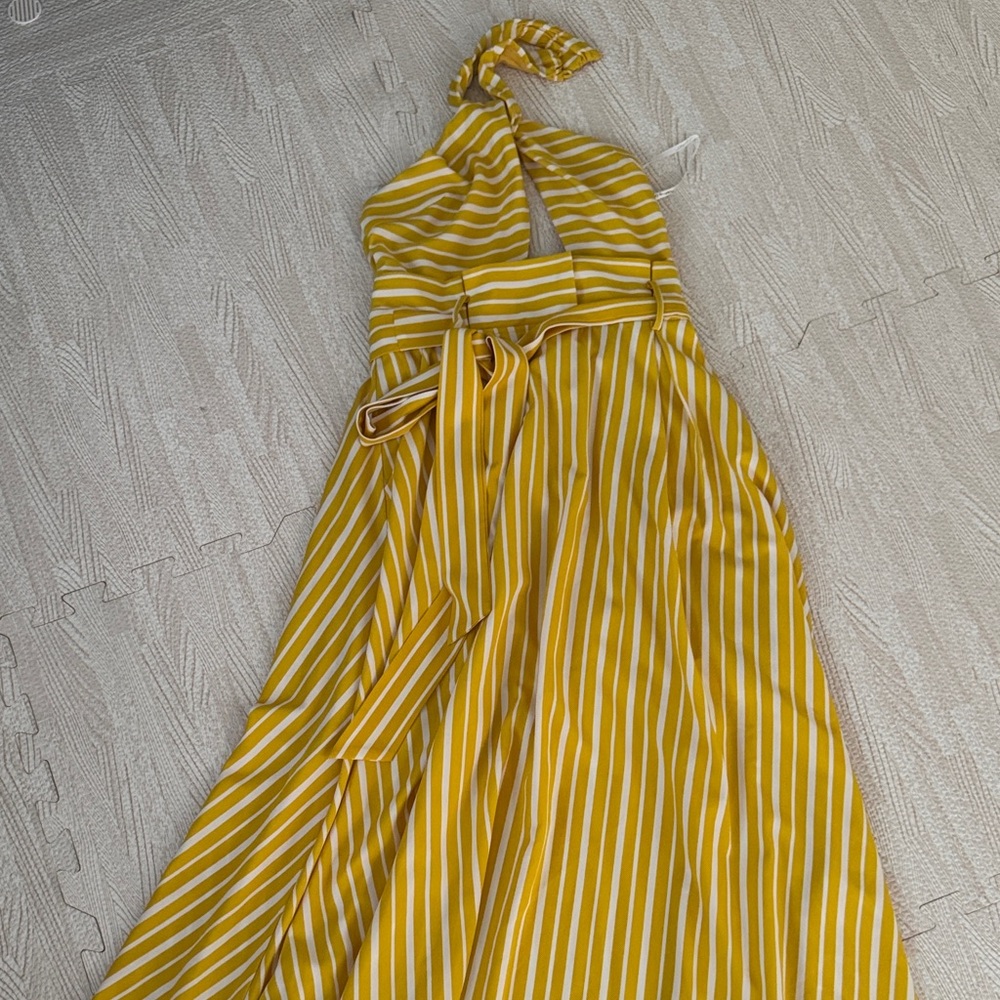 the clothing company Mustard and White Striped Halter Maxi Dress